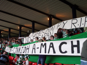 Football fans with anti- fascism banners 